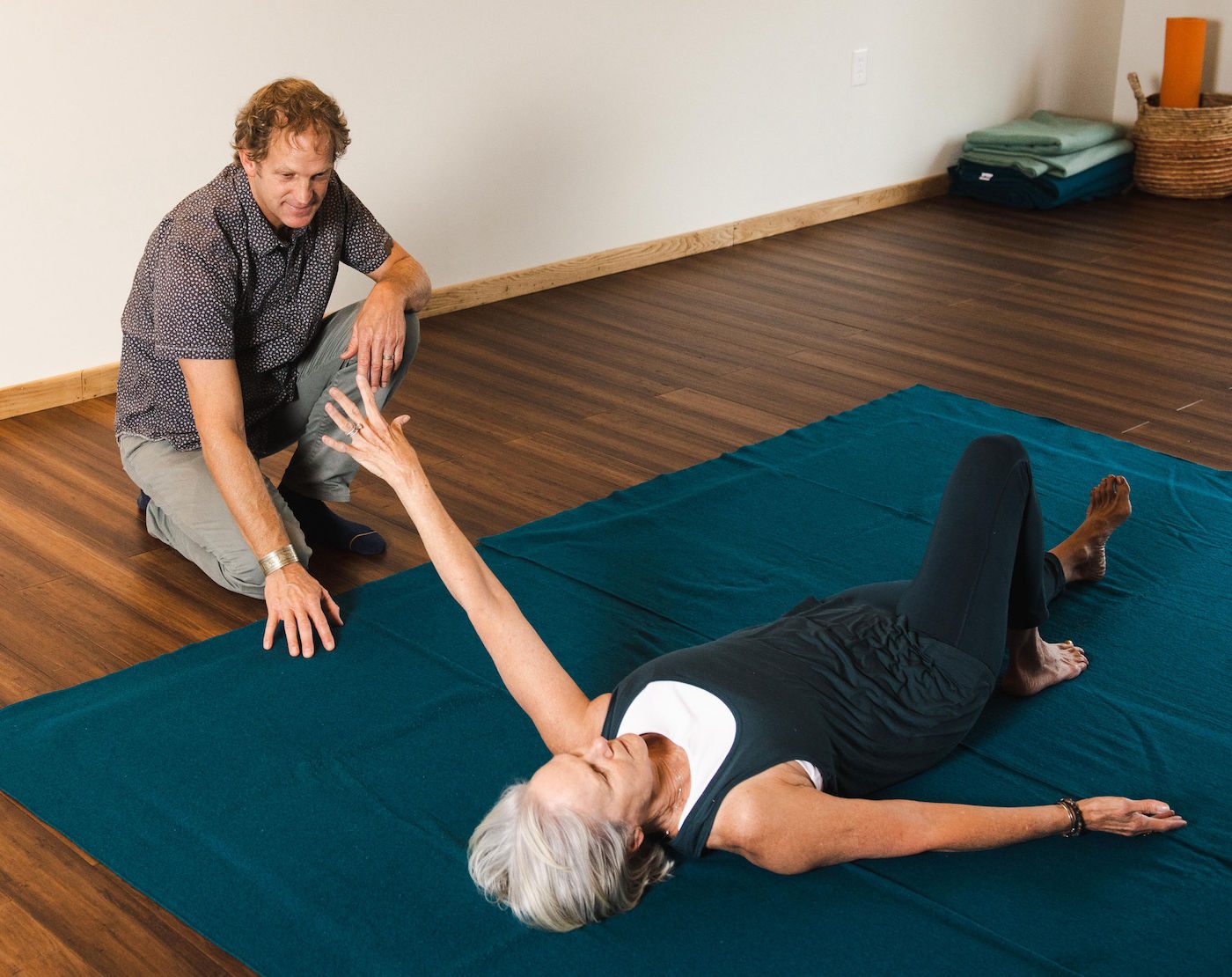 chad guiding client yoga therapy at yoga highlands studio